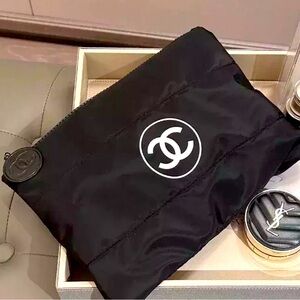 New rare and collectible puffy pouch, clutch or cosmetic bag with zipper / logo